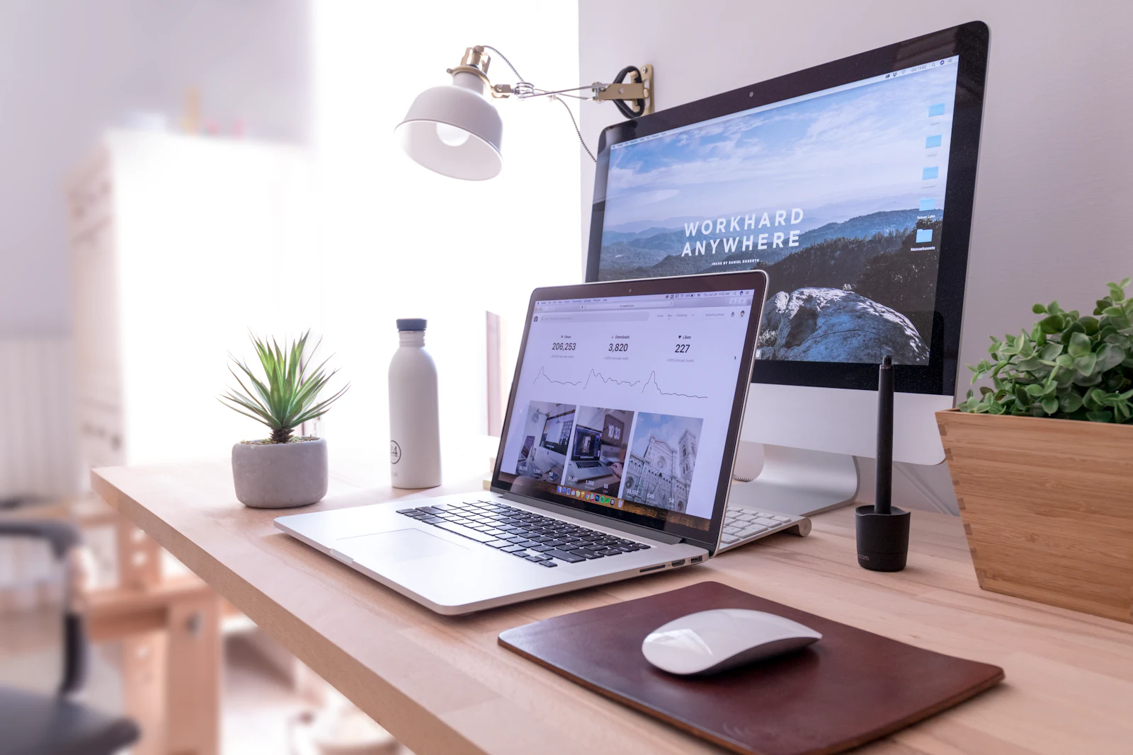 Designer working on a website layout on a laptop